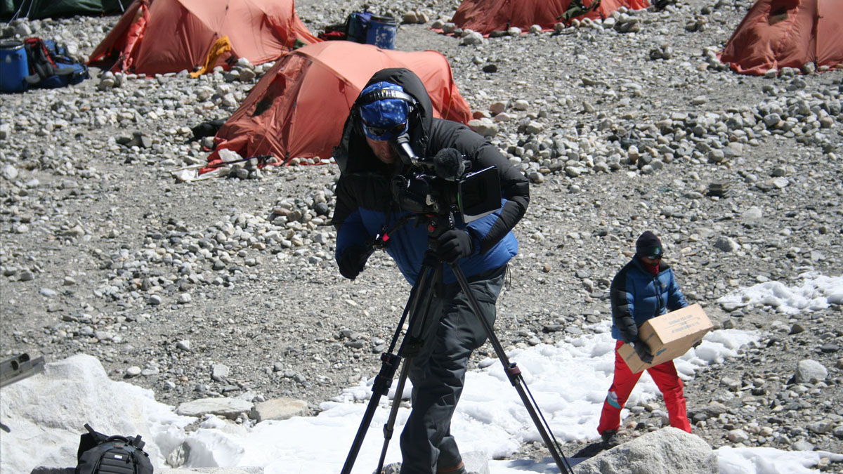 Army on Everest, Everest West Ridge Expedition, base camp, cameraman filming, tents in background