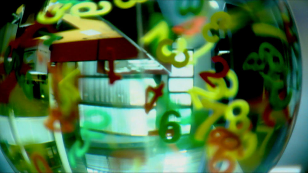 Standard Life Director Vision, video garage image, creative abstract colourful numbers in a globe filmed in daylight with a fish eye lens, set between an atrium and office background 